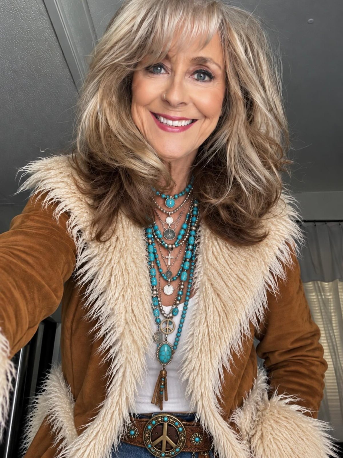 70's Inspired Outfits: 13 Retro Looks to Try Right Now 11 Woman wearing a brown suede faux-fur jacket and layered turquoise beaded necklaces.