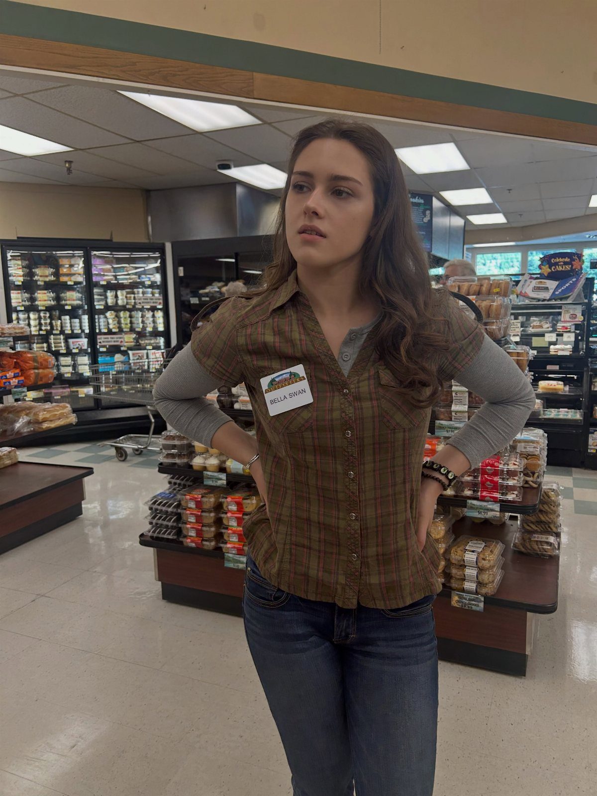 Bella Swan Outfits: 10 Iconic Looks from the Twilight Saga 1 Woman wearing a brown plaid shirt and blue jeans in a grocery store