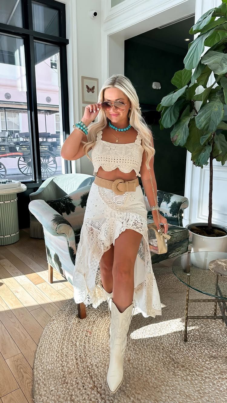 Concert Outfits for Women: 8 Looks That Work for Any Venue 5 Woman in white lace two-piece outfit and white cowboy boots posing indoors.