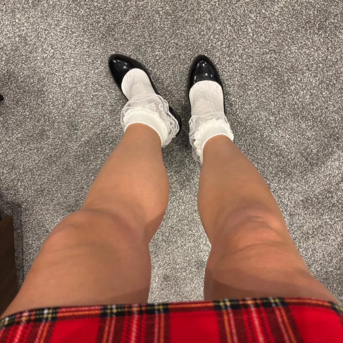 Dark Academia Outfits Female: 12 Ideas for Timeless Style 6 White frilly ankle socks and black loafers worn with a red plaid skirt.