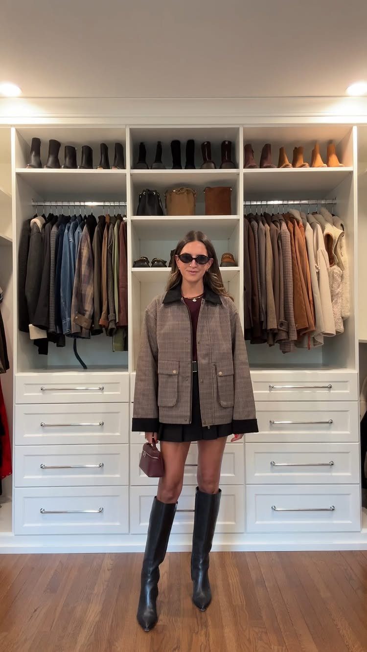 Fall Outfits for Women: 9 Ideas From Denim to Burgundy 2 Woman wearing a checkered barn jacket, black mini skirt, and tall black boots.