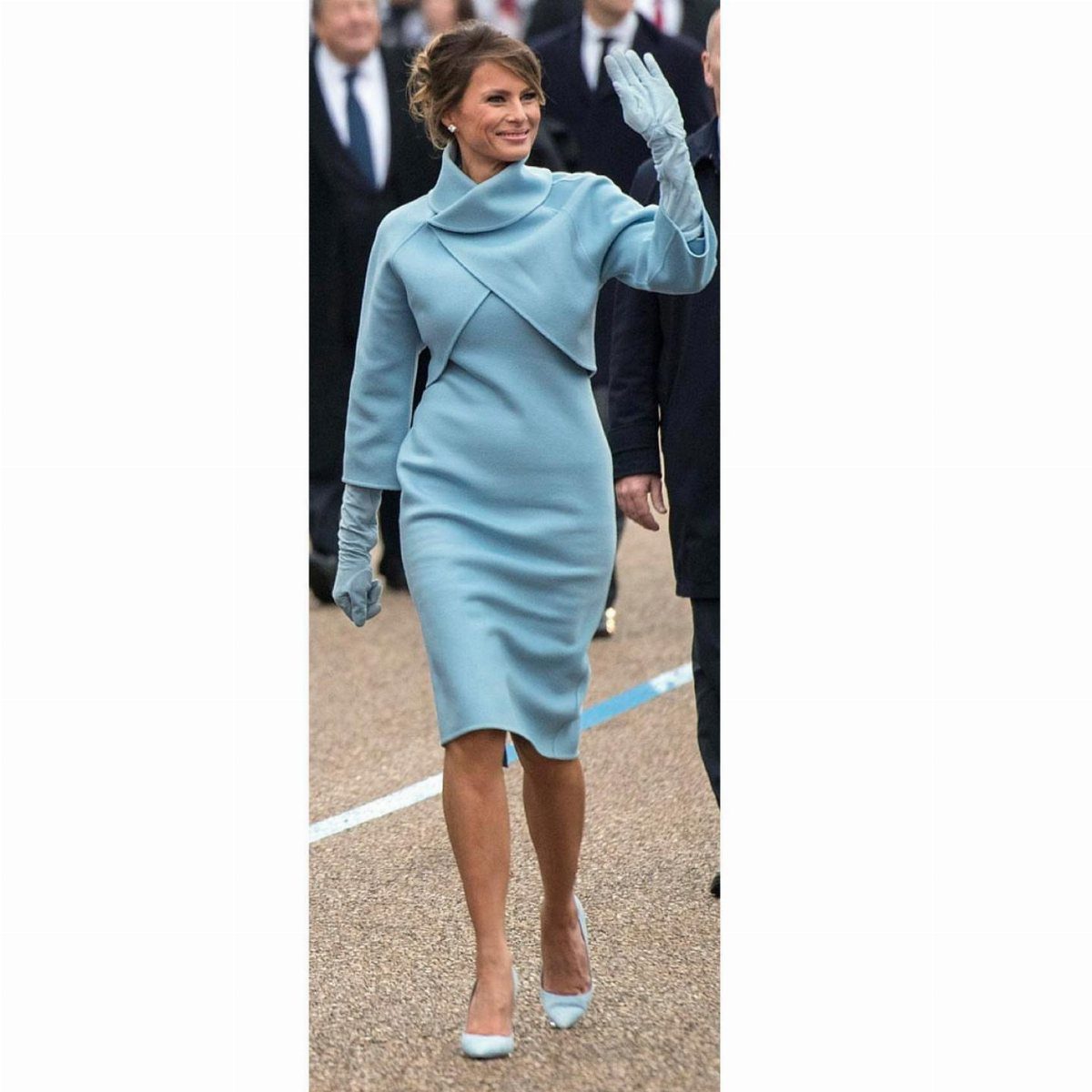 First Lady Outfits: 6 Timeless Looks to Inspire Your Style 1 Melania Trump in a light blue tailored dress and matching cape with gloves.