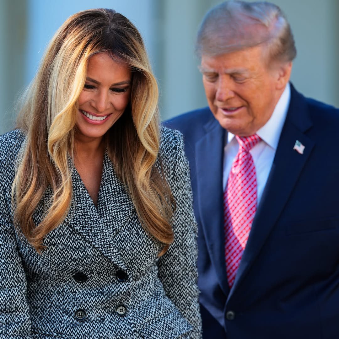 First Lady Outfits: 6 Timeless Looks to Inspire Your Style 2 Melania Trump in a grey herringbone tweed coat standing beside Donald Trump.