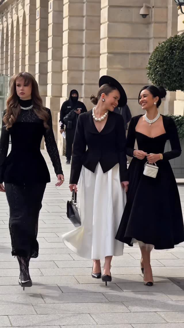 8 High Tea Outfits From Casual to Formal 7 Three women in elegant black and white formal dresses and pearls walking outdoors.