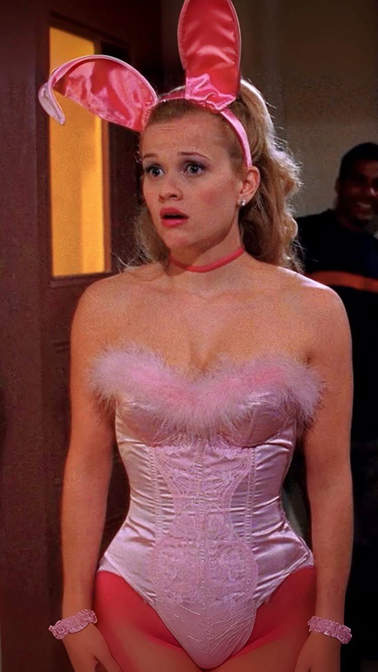 10 Legally Blonde Outfits to Channel Elle Woods in 2026 5 Woman wearing a pink satin bunny costume with faux fur and bunny ears.