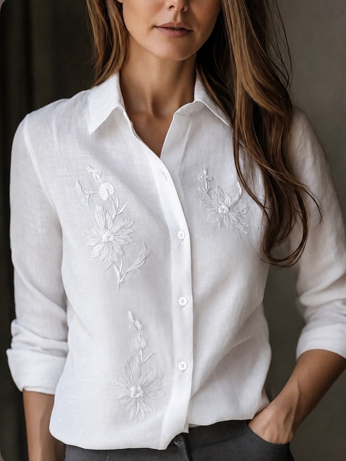 Light Summer Outfits: 8 Fresh Ideas for Cool, Soft Style 3 White linen blouse with floral embroidery worn by a woman with long brown hair.