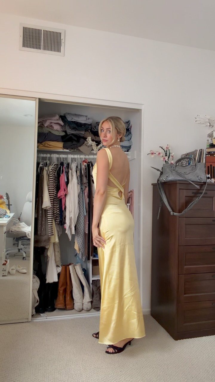 10 Lizzie McGuire Movie Outfits That Defined Y2K Fashion 8 Woman in a long yellow satin dress posing in front of a closet.