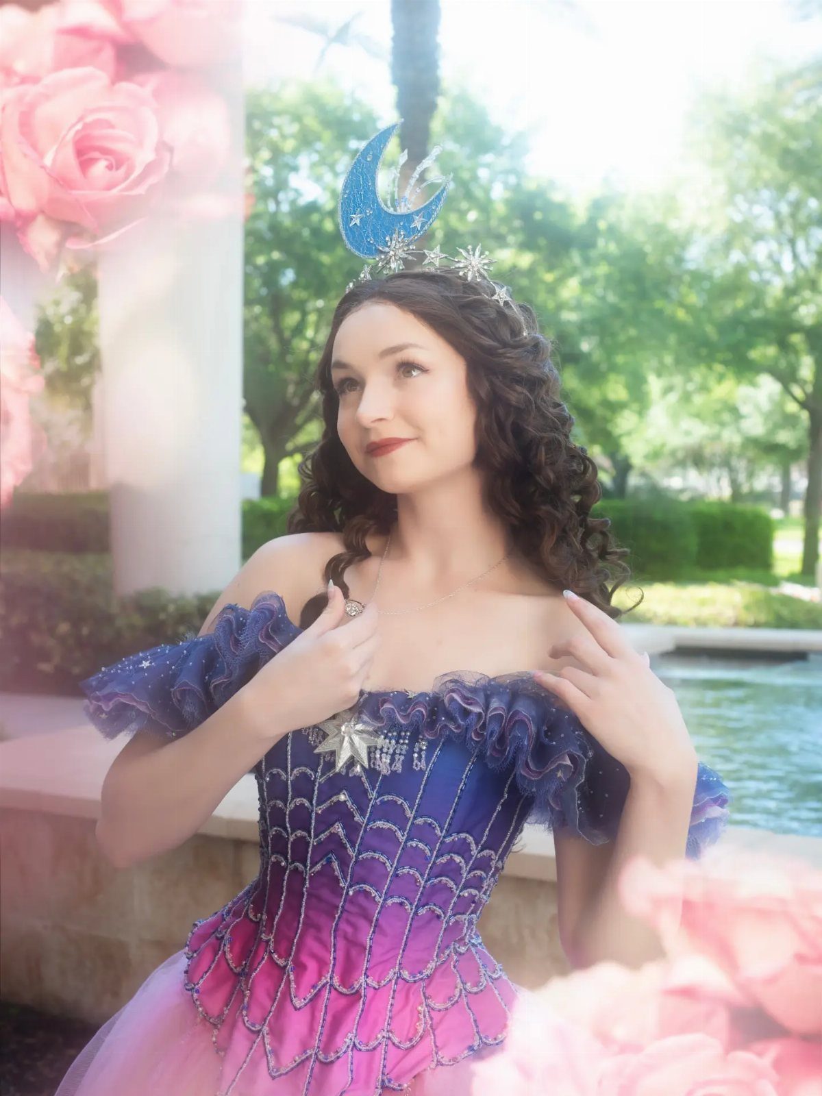 10 Stunning Masquerade Outfits for Women to Wear This Year 6 Woman in a blue and pink gradient corset dress with a moon headpiece.
