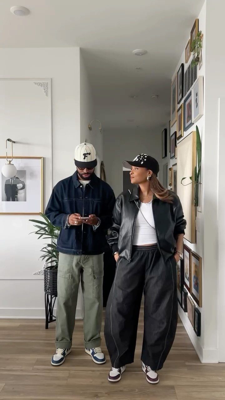 Matching Outfits for Couples: 6 Ideas from Gym to Formal 5 Couple wearing casual streetwear, man in navy jacket and woman in black leather jacket.