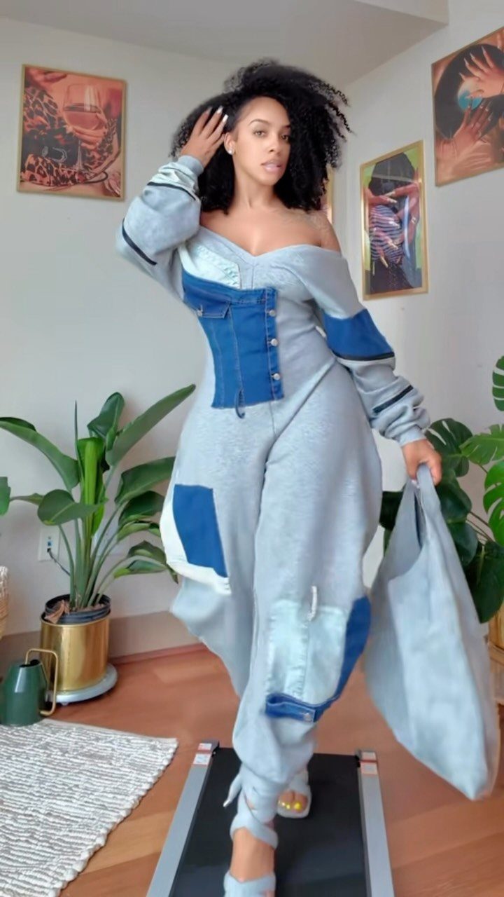 Off Shoulder Outfits: 8 Ideas from Casual to Dressed Up 2 Woman wearing a grey and blue off-the-shoulder jumpsuit standing on a treadmill indoors.