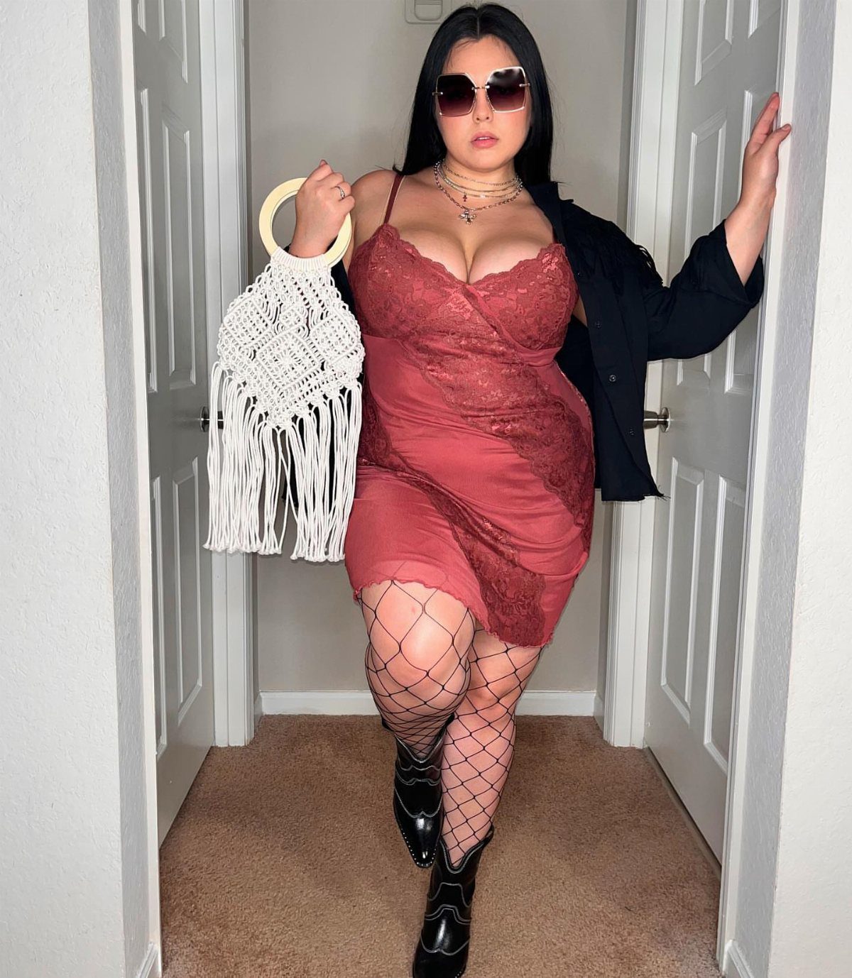 Plus Size Festival Outfits: 9 Looks You'll Want to Wear 1 Plus-size woman in red lace dress wearing multiple layered gold necklaces and sunglasses.