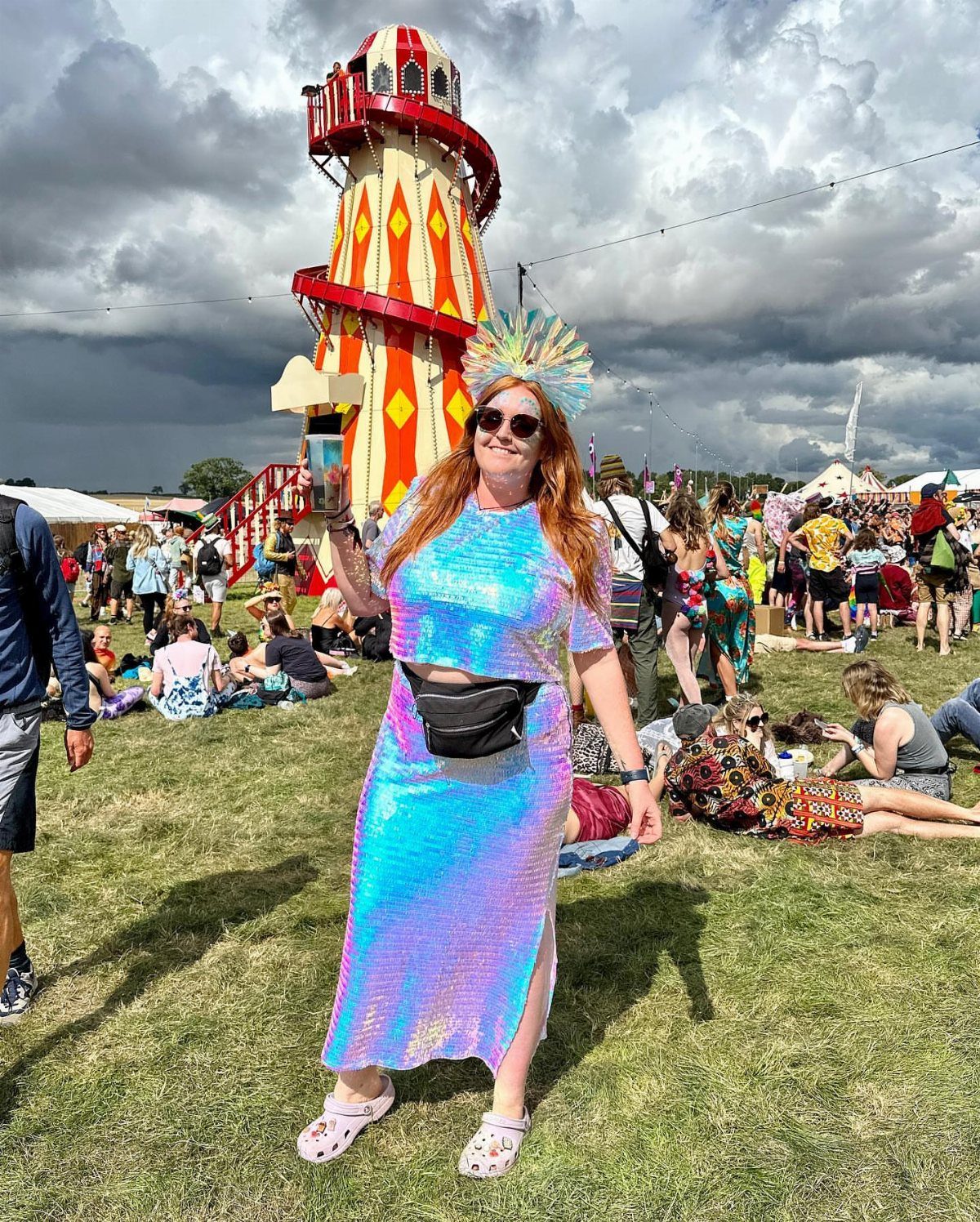 Plus Size Festival Outfits: 9 Looks You'll Want to Wear 2 Woman in iridescent blue and purple sequined festival outfit standing in a grassy field.