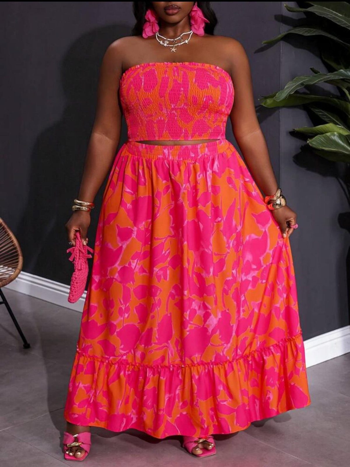 Plus Size Festival Outfits: 9 Looks You'll Want to Wear 7 Plus-size woman in a pink and orange floral crop top and maxi skirt set