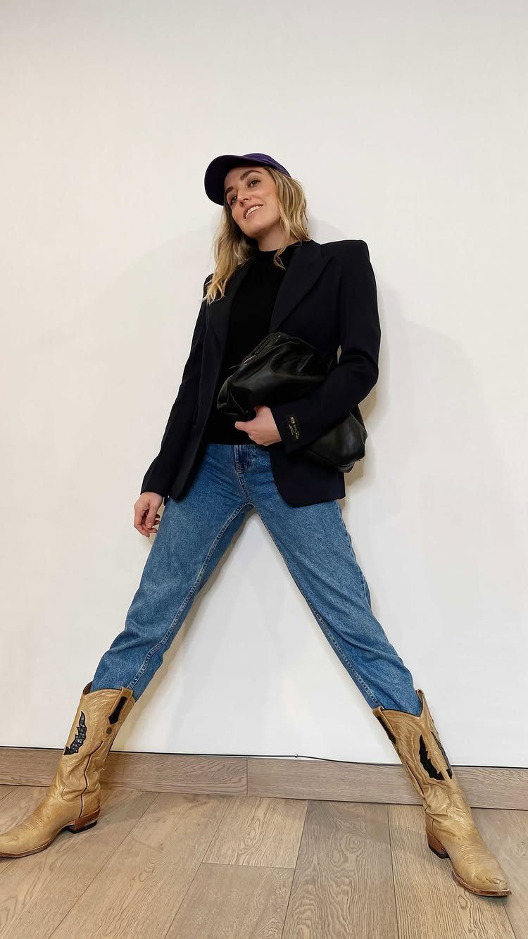 Princess Diana Outfits That Defined Royal Style (11 Ideas) 11 Woman wearing a navy blazer with blue jeans and tan cowboy boots.