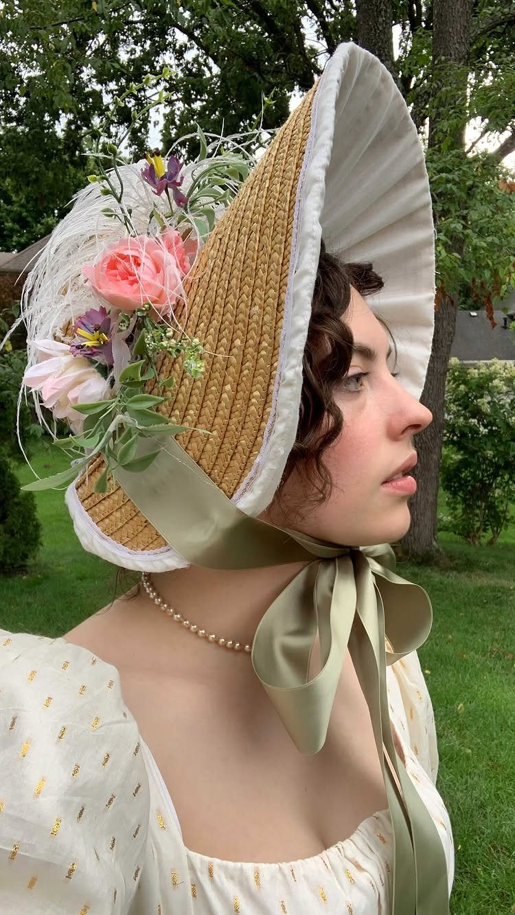 Regency Era Outfits Women Wore: 9 Elegant Period Pieces 5 Woman wearing a floral straw bonnet with a wide white brim and ribbon.