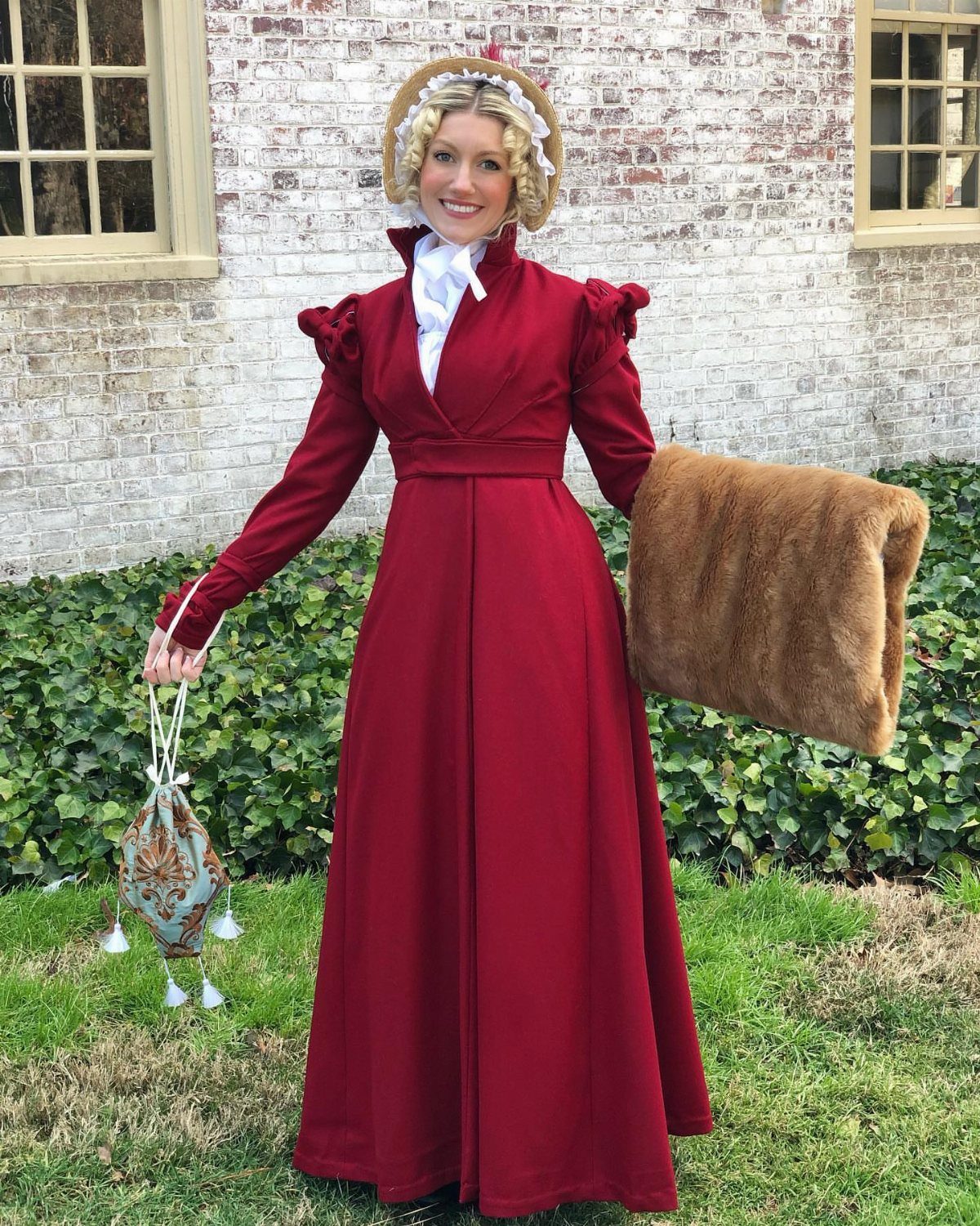 Regency Era Outfits Women Wore: 9 Elegant Period Pieces 4 Woman in a long red Regency pelisse coat, straw bonnet, and fur muff.