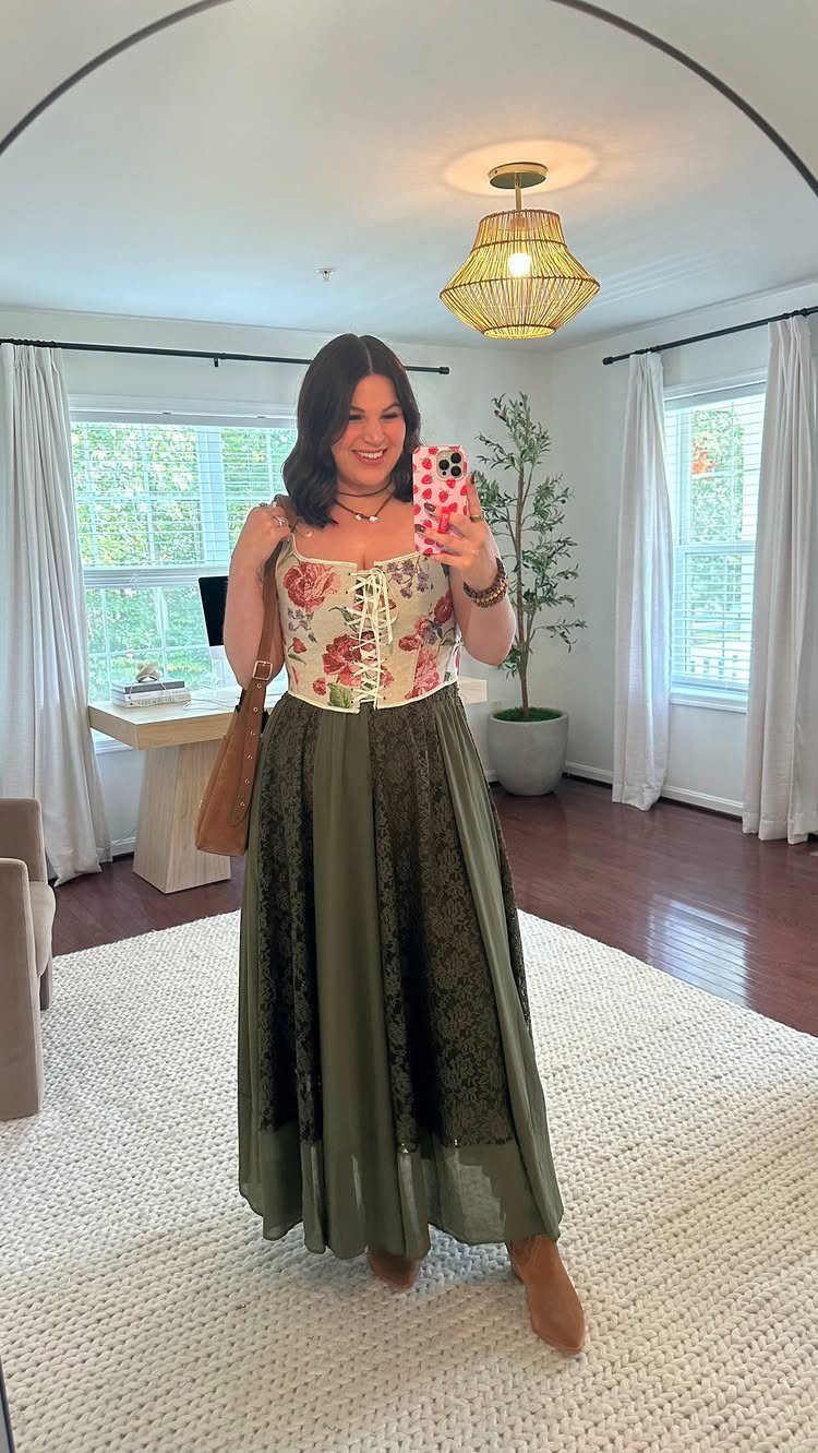 Renaissance Fair Outfits Women Can Wear: 12 Looks 12 Woman wearing a floral lace-up bodice and long olive green lace skirt.