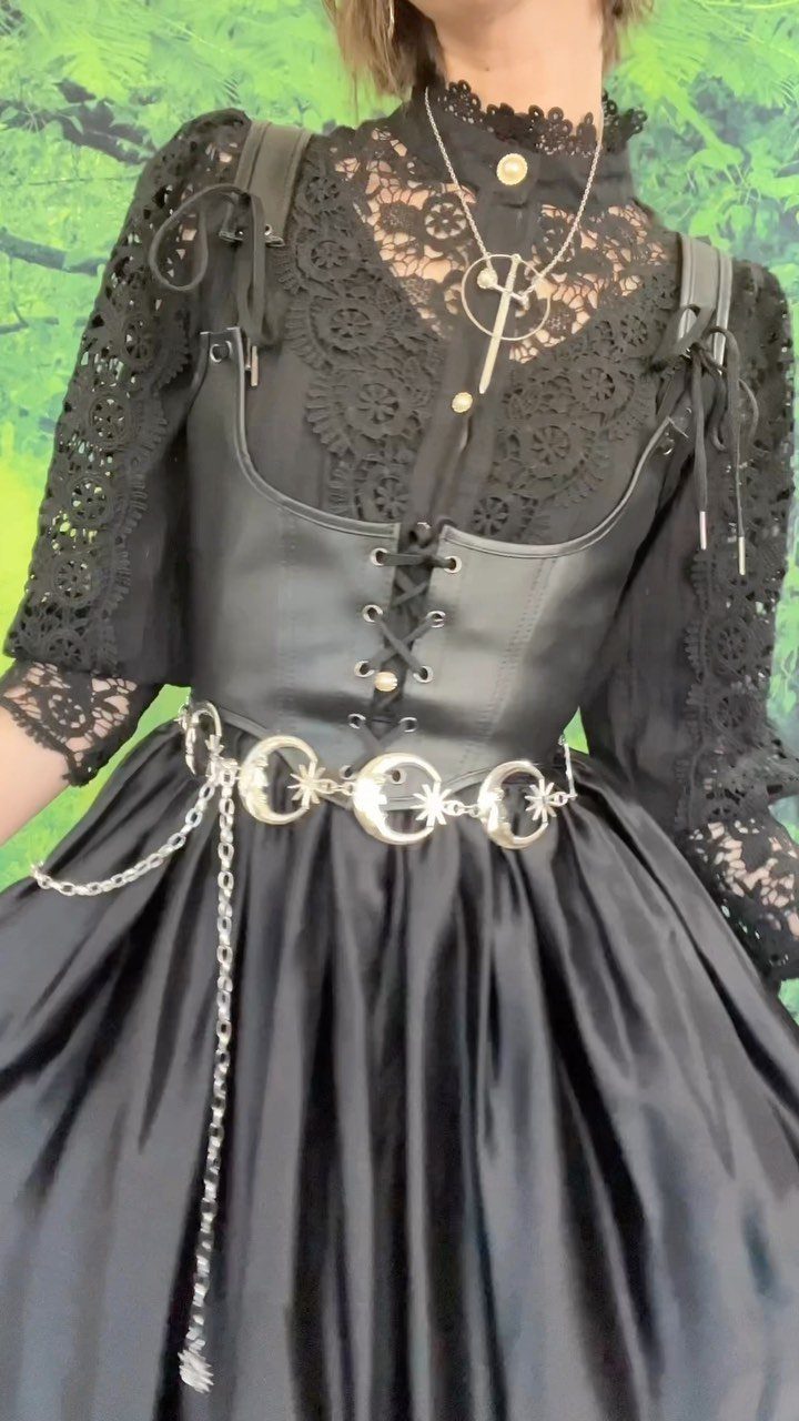 Renaissance Fair Outfits Women Can Wear: 12 Looks 7 Woman in black lace blouse, leather bodice, and moon belt for Renaissance fair.