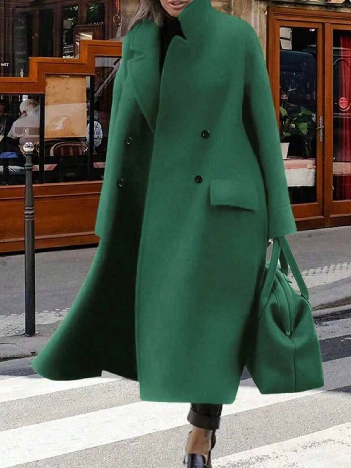 14 Serena van der Woodsen Outfits That Defined Gossip Girl Style 11 Woman in an oversized emerald green wool coat and matching handbag walking on street.