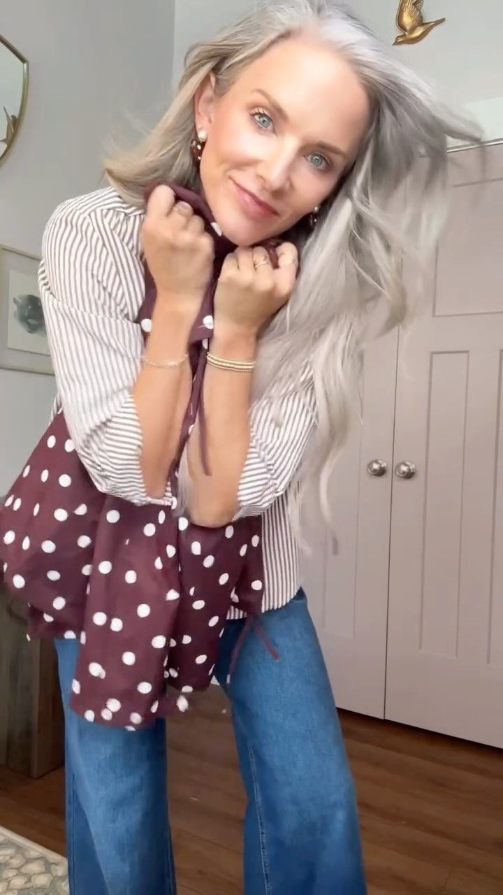 7 Wacky Wednesday Outfits for School, Work & Beyond 1 Woman wearing a striped shirt and maroon polka-dot apron with blue flared jeans.