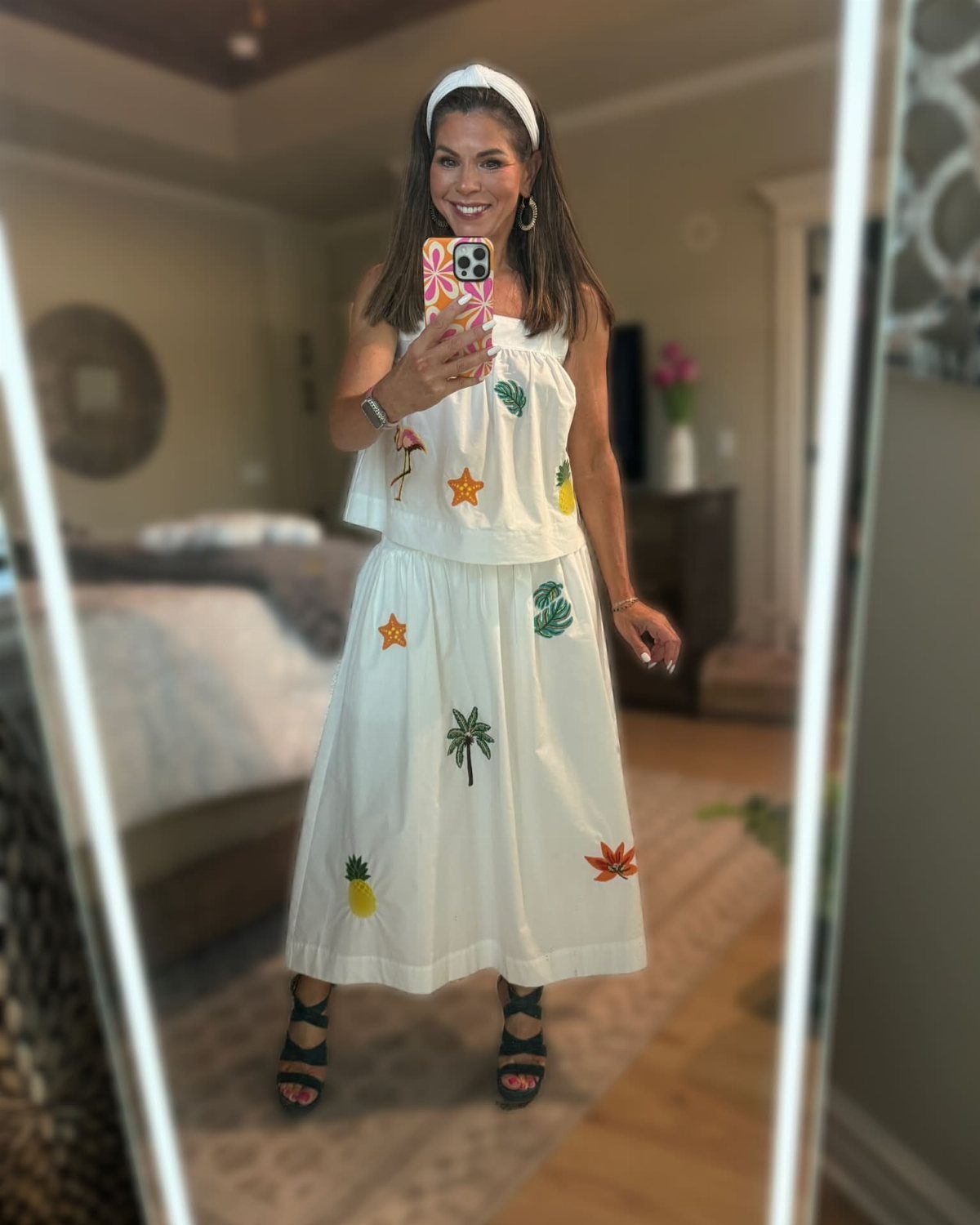 Walmart Spring Outfits: 10 Fresh Ideas for Women This Season 10 Woman in white embroidered tropical two-piece set and headband taking a mirror selfie.