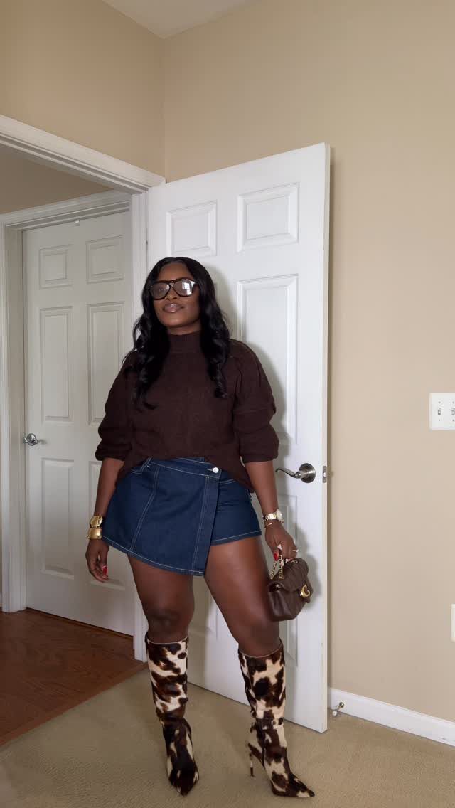 Washington DC Outfits: 11 Stylish Ideas for Your Trip 10 Woman wearing a brown top, denim skirt, and cow-print boots standing indoors.