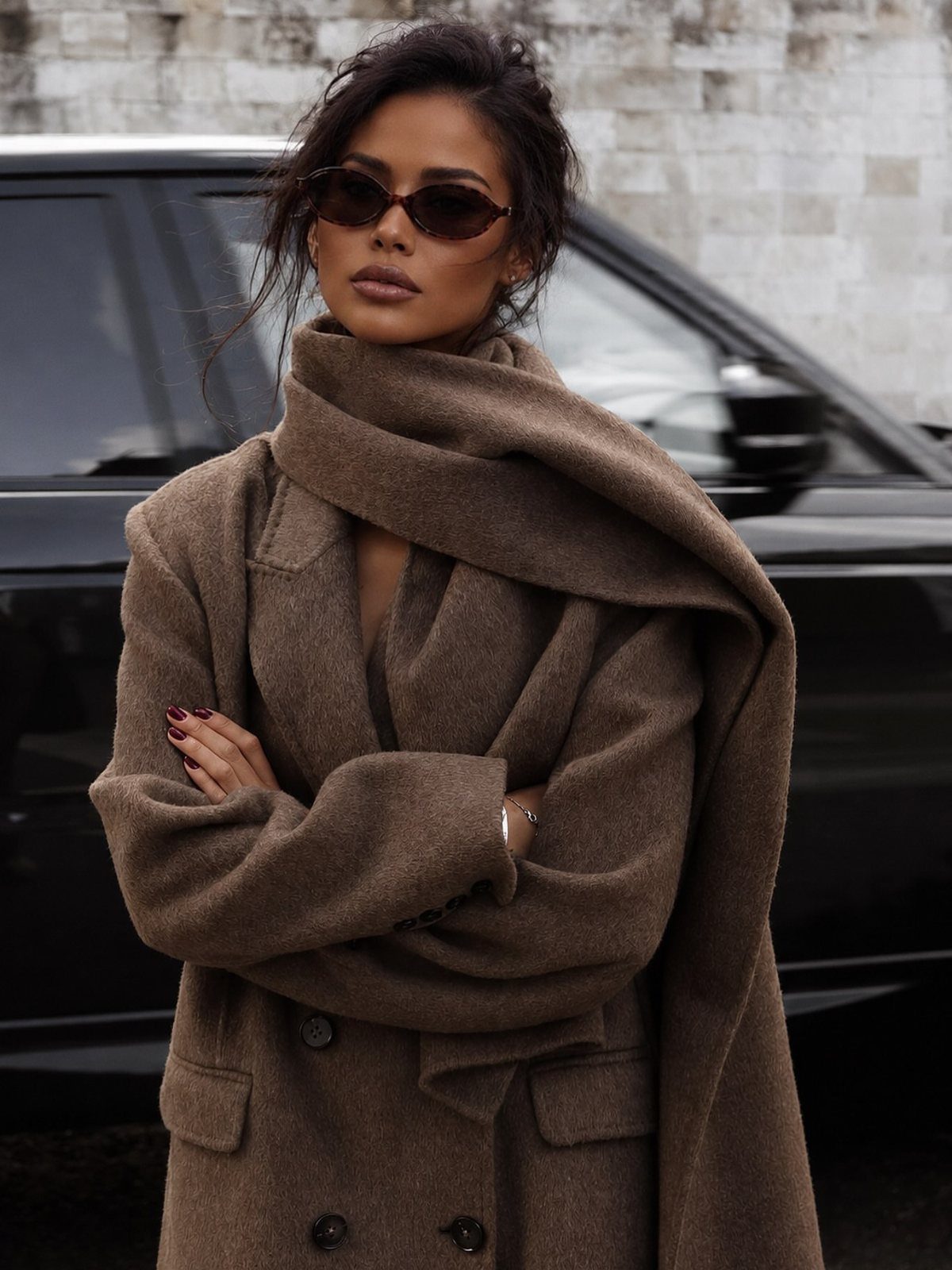 Women's Scarf Coat: 12 Ideas to Try This Season 2 Woman in a camel oversized wool coat and matching scarf posing by a car