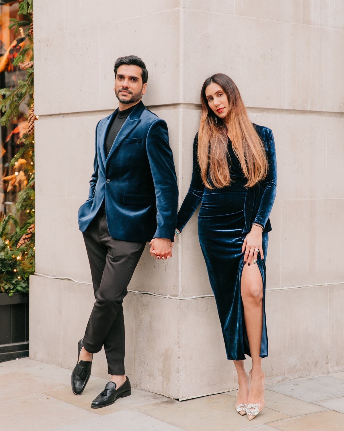 13 Zara Holiday Outfits for Parties and Celebrations 10 Man in blue velvet blazer and woman in blue velvet dress posing together.